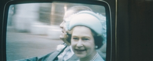 A television screen showing the Queen of England at the marriage of Prince Charles to Diana Spencer, a 1980s 35mm film slide photo. Photo by  Annie Spratt via Unsplash.